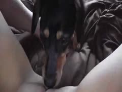 A teen from Whitney, Wisconsin, is licked by a dog.